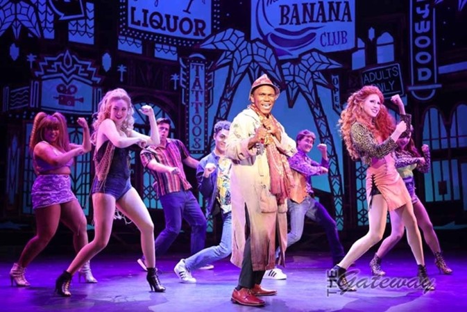 Actors performing Pretty Woman onstage at the Gateway