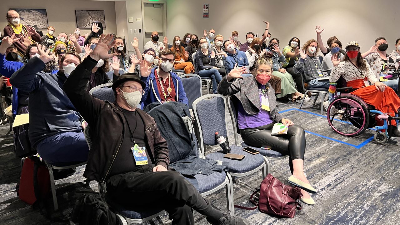 Big Bad Con attendees waving to the camera