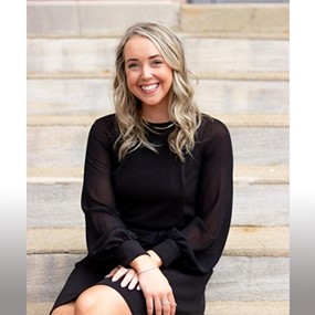 Hannah McGill sitting on steps
