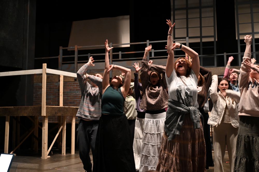 The Sweeney Todd ensemble performing a musical number during rehearsal