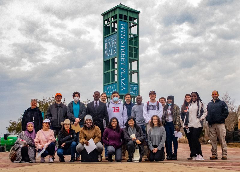 Group of people standing in front of a tower