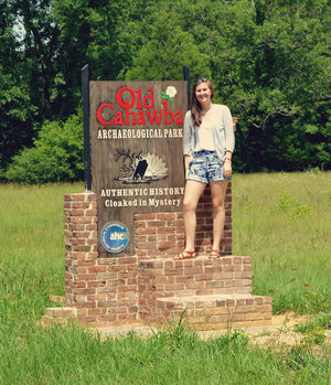 Lowery McNeal stands in front of the Old Cahawba sign