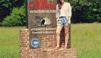 Lowery McNeal stands in front of the Old Cahawba sign