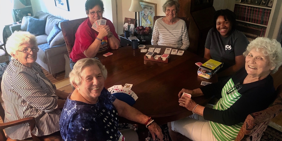 A group of Living Democracy participants playing cards