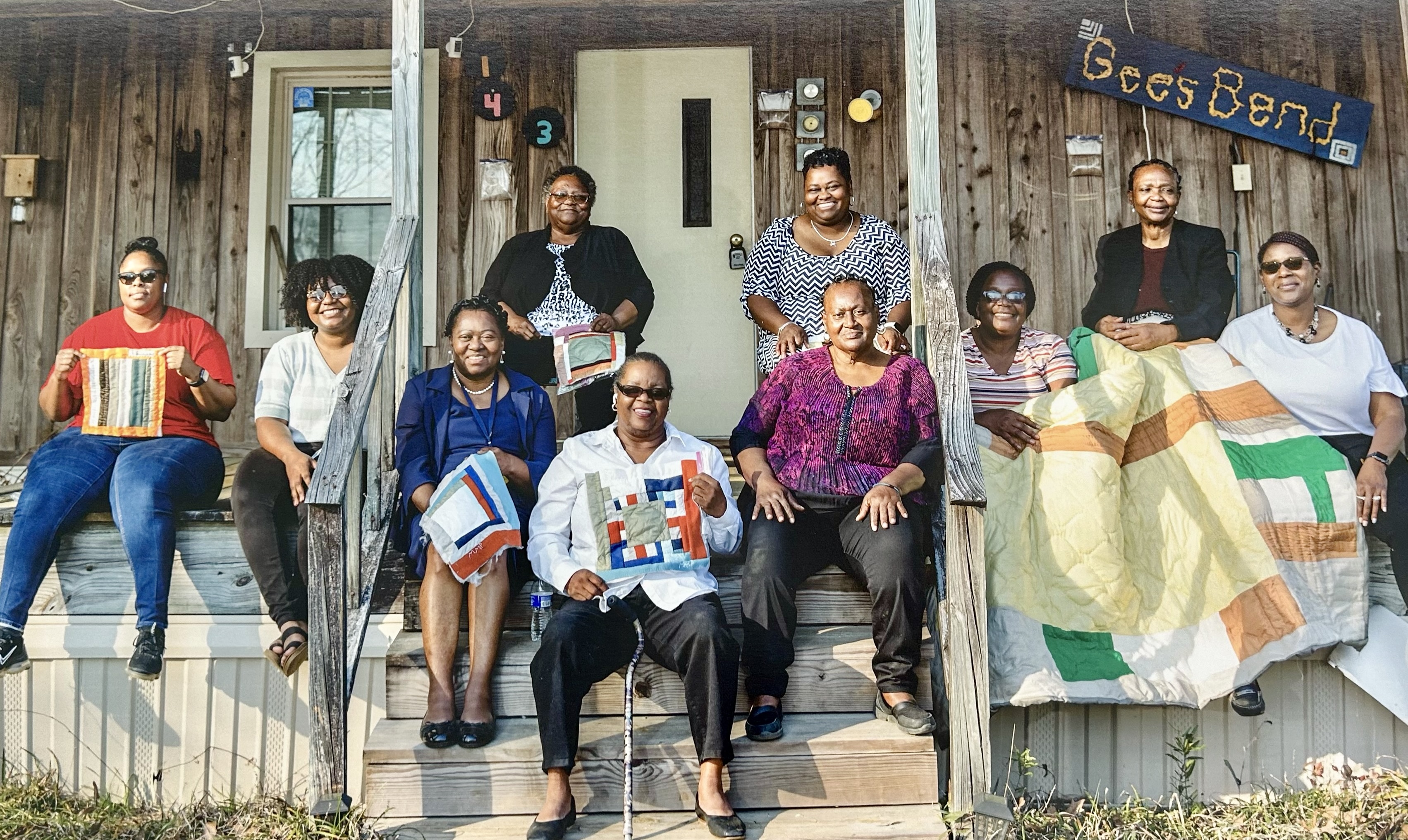 Quilt artists at the Gee’s Bend Welcome Center are, from left to right,  Veronica Saulsberry, Kristin Pettway, Lue Ida McCloud, Doris Pettway Mosley, Mary Margaret Pettway, Monica Waller (top), Sharon Williams, Pleasant Scott, Stella Mae Pettway (top), and Cassandra Pettway.