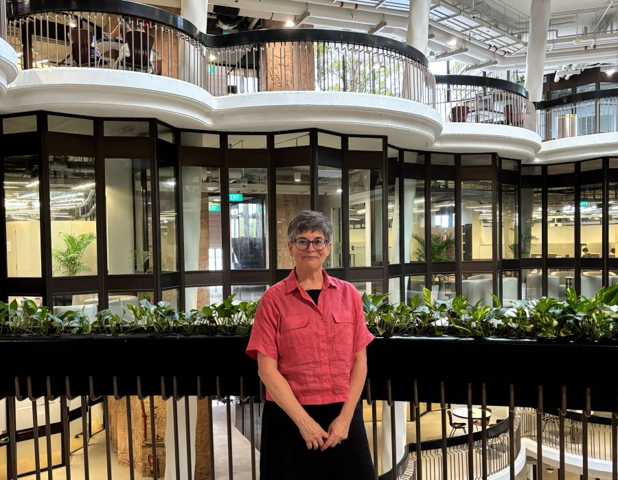 Arianne Gaetano standing in a lobby in a building in Singapore