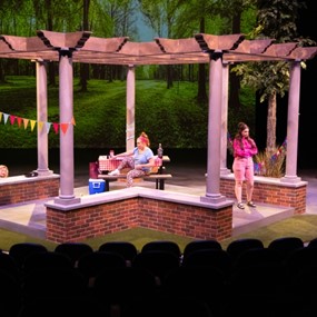 Brick and wood pavilion on a theatre stage 