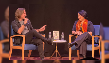 Matthew Mercer and Emily Friedman speaking on stage 