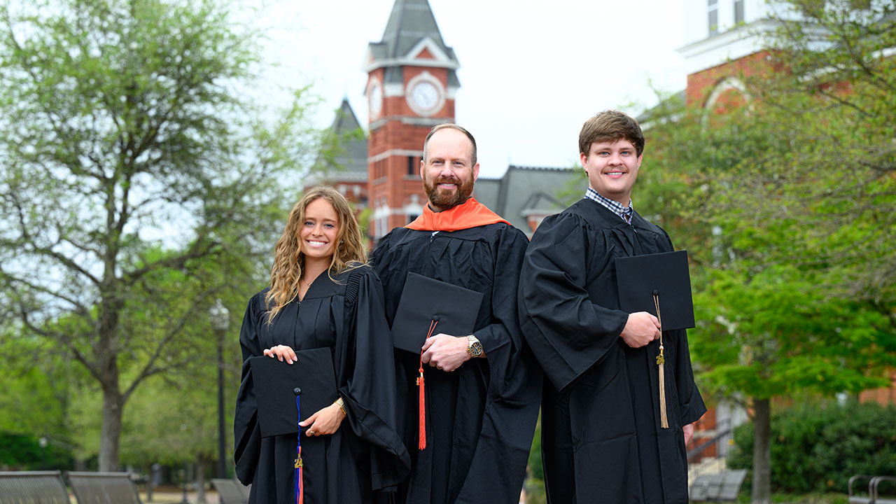 Abbey, Jamie and Avery Heath in graduation caps and gowns