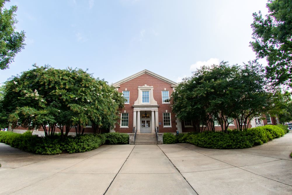 Cary Hall under a bright blue sky