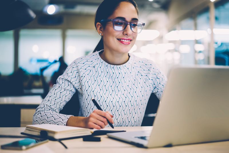 Woman looking at a laptop computer screen