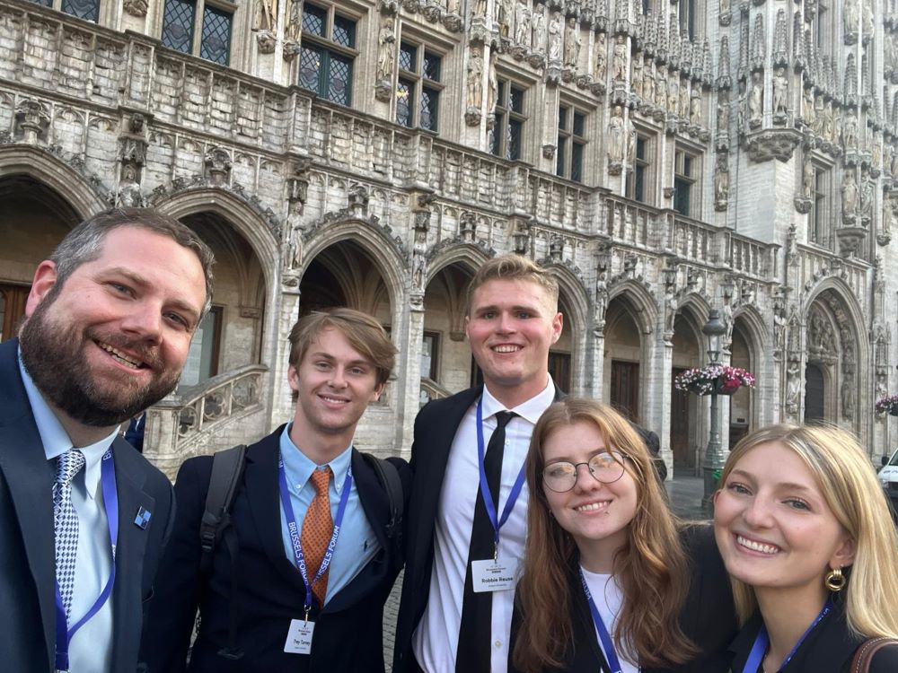 Matt Clary and students outside the Brussels Forum